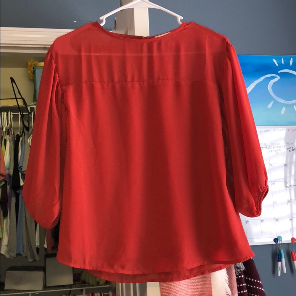 Burnt orange colored top